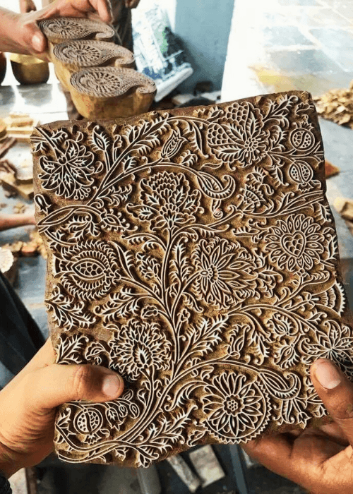 Traditional Sanganeri wooden printing blocks with floral motifs used in textile printing