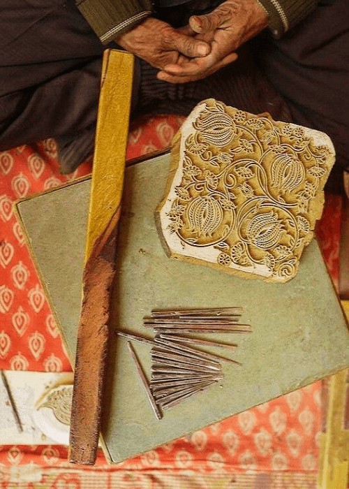 Traditional Sanganeri wooden printing blocks with floral motifs used in textile printing
