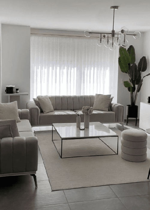 Neutral gray interior palette creating an impersonal home atmosphere