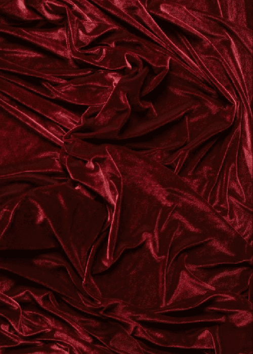 Close-up of velvet fabric showing dense pile texture and soft light absorption