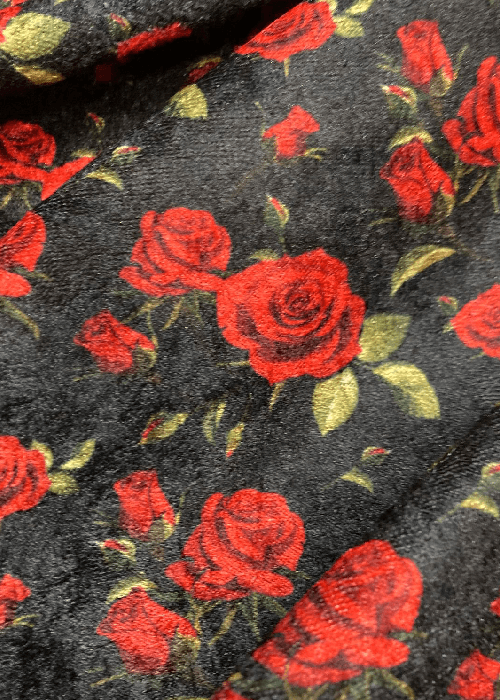 Close-up of rose floral print fabric inspired by garden roses and heritage textile motifs