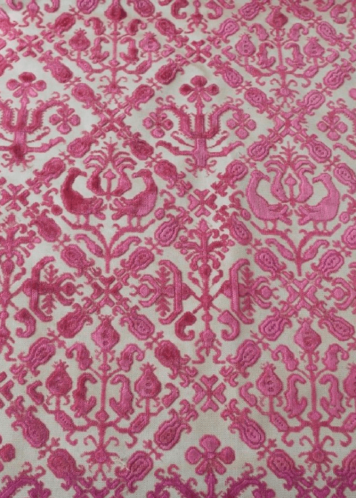 Voided velvet with sheer sections creating a contrast in texture.