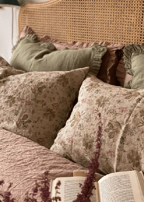 Washed linen and cotton home furnishings showing natural texture, breathable weave, and relaxed, lived-in surface for modern interiors.