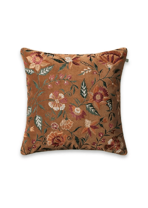 Plush velvet fabric in deep tones showing dense pile, soft texture, and light-responsive surface used in upholstery and soft furnishings.