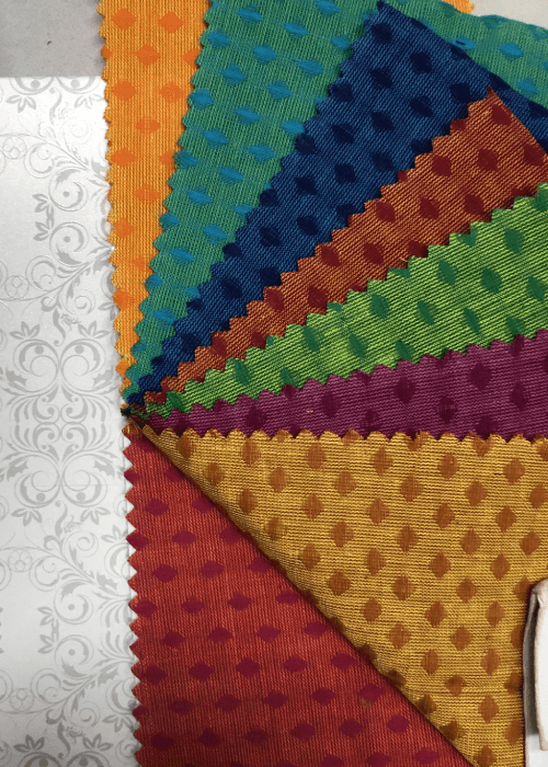 Powerloom woven fabric with a smooth, uniform texture produced using modern mechanised weaving technology.