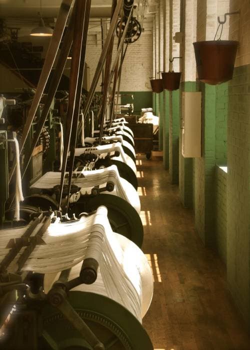Powerloom woven fabric with a smooth, uniform texture produced using modern mechanised weaving technology.
